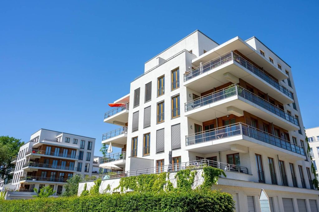 Uptown Terrace Residence: White modern residential building with glass balconies in Uptown, Dallas, TX
